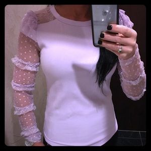 Very pale mauve colored lace t-shirt.